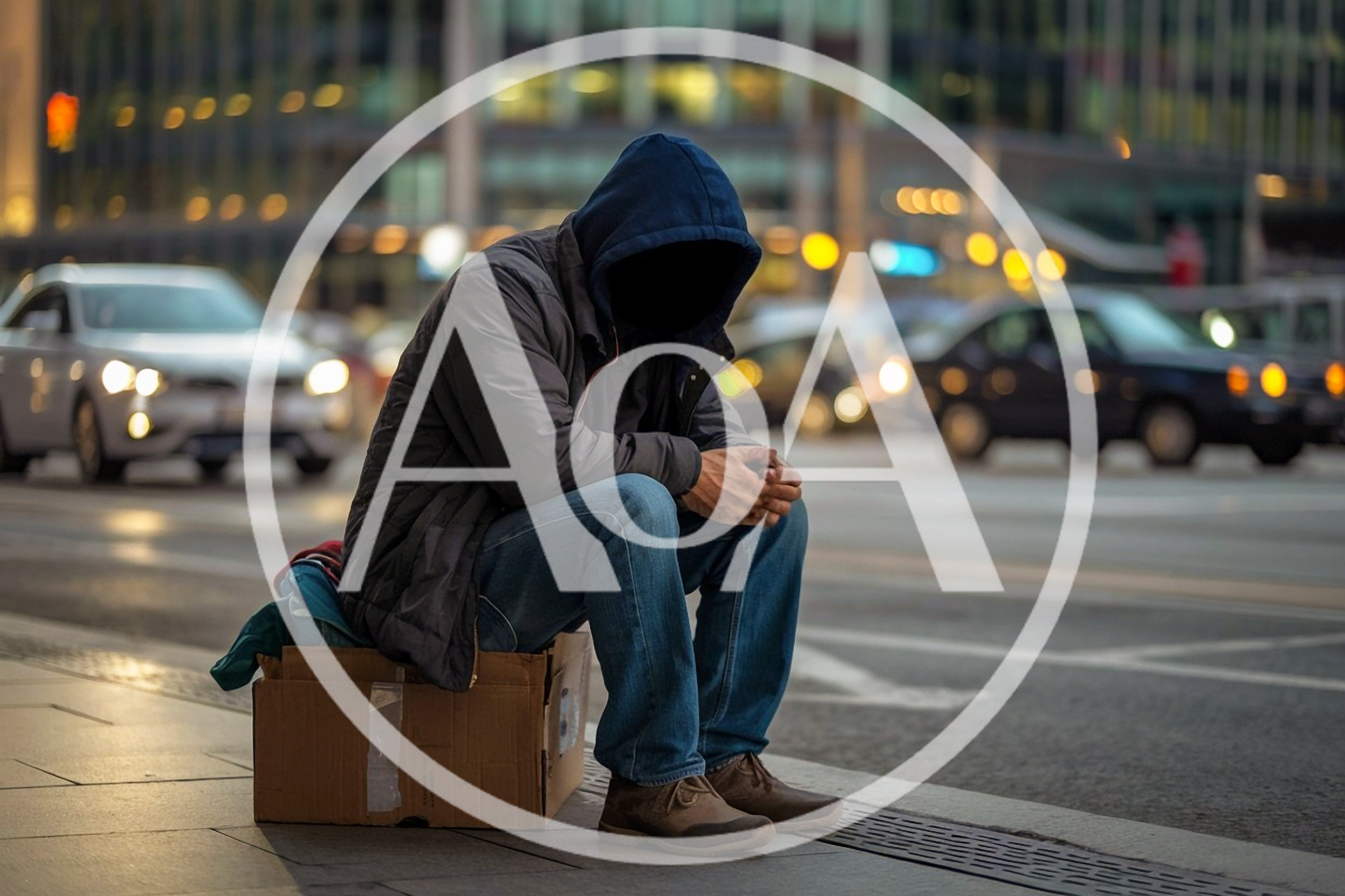 Homeless Person Sitting On Cardboard Box In City