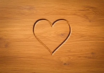 Carved Heart Shape On Wooden Surface