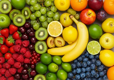 Assorted Fresh Fruits Arranged On A Flat Surface