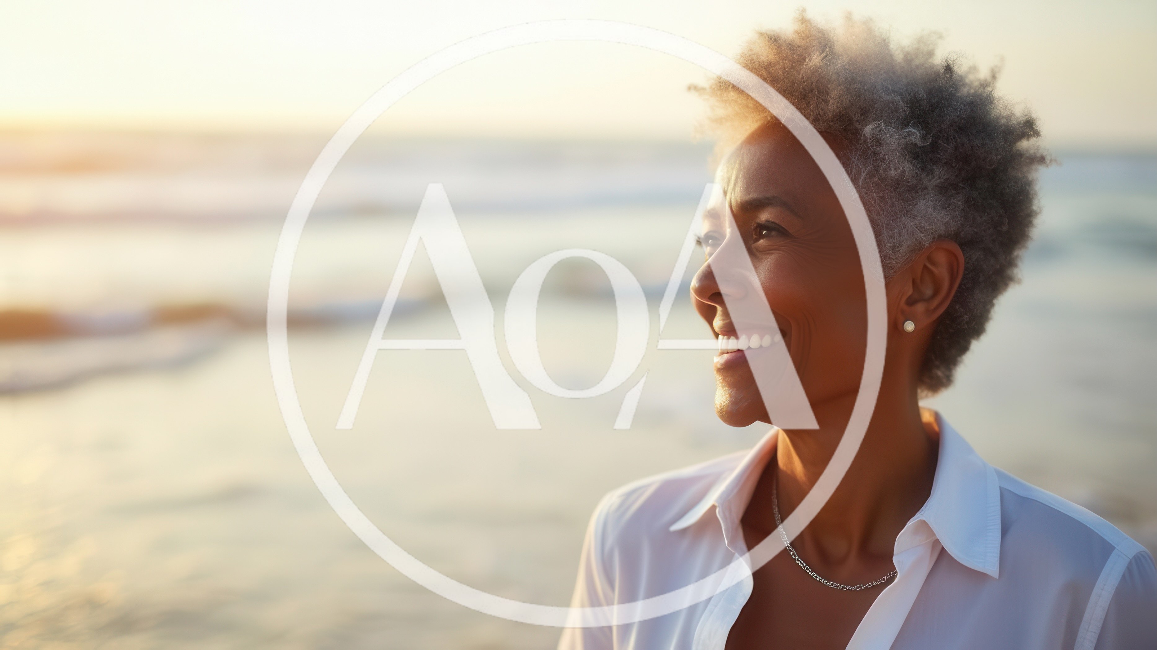 Mature Woman Smiling While Looking Out At The Ocean