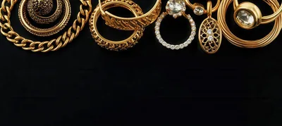 Collection Of Elegant Gold Jewelry On Black Background