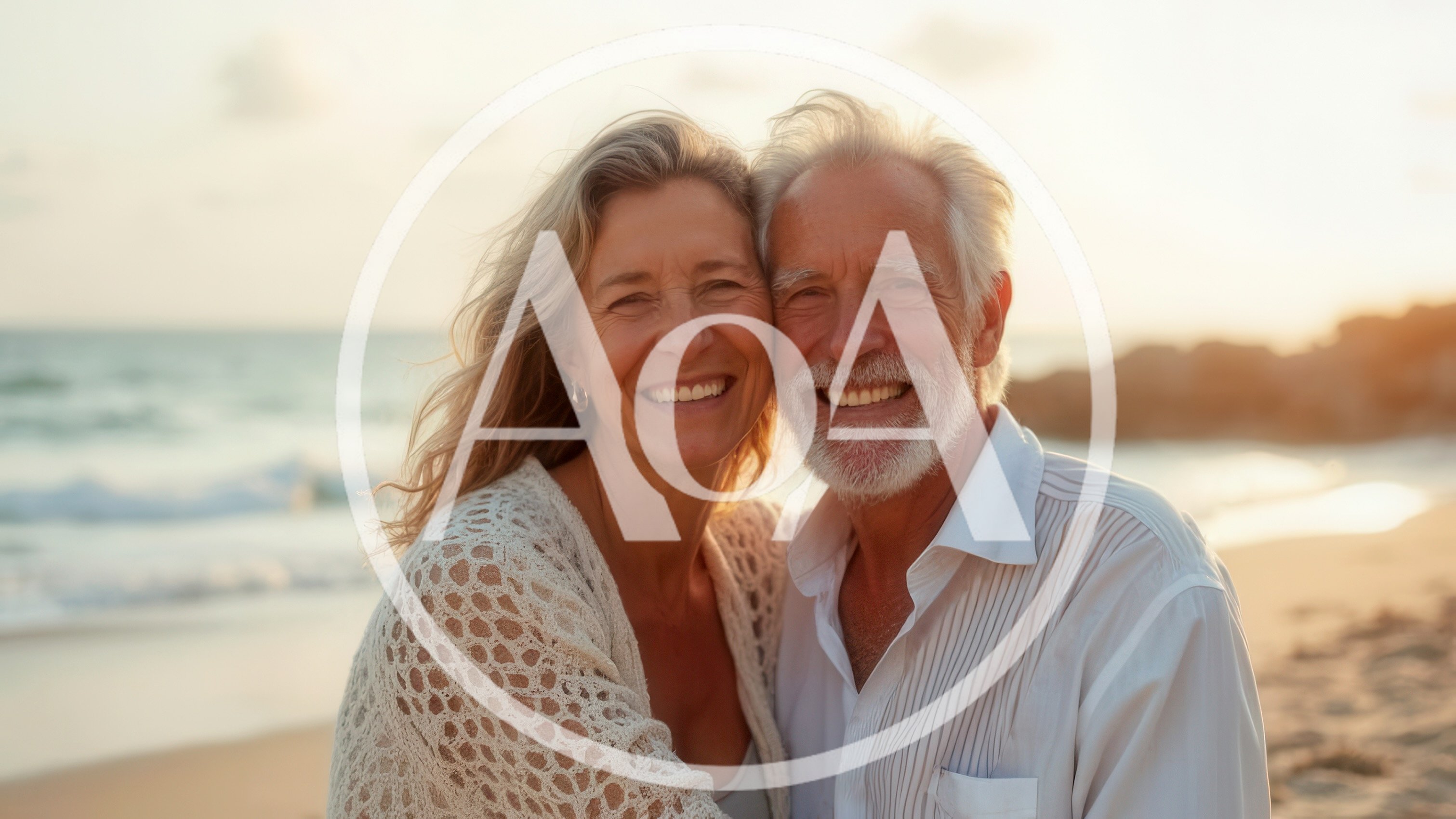 Happy Senior Couple Embracing on a Beach at Sunset