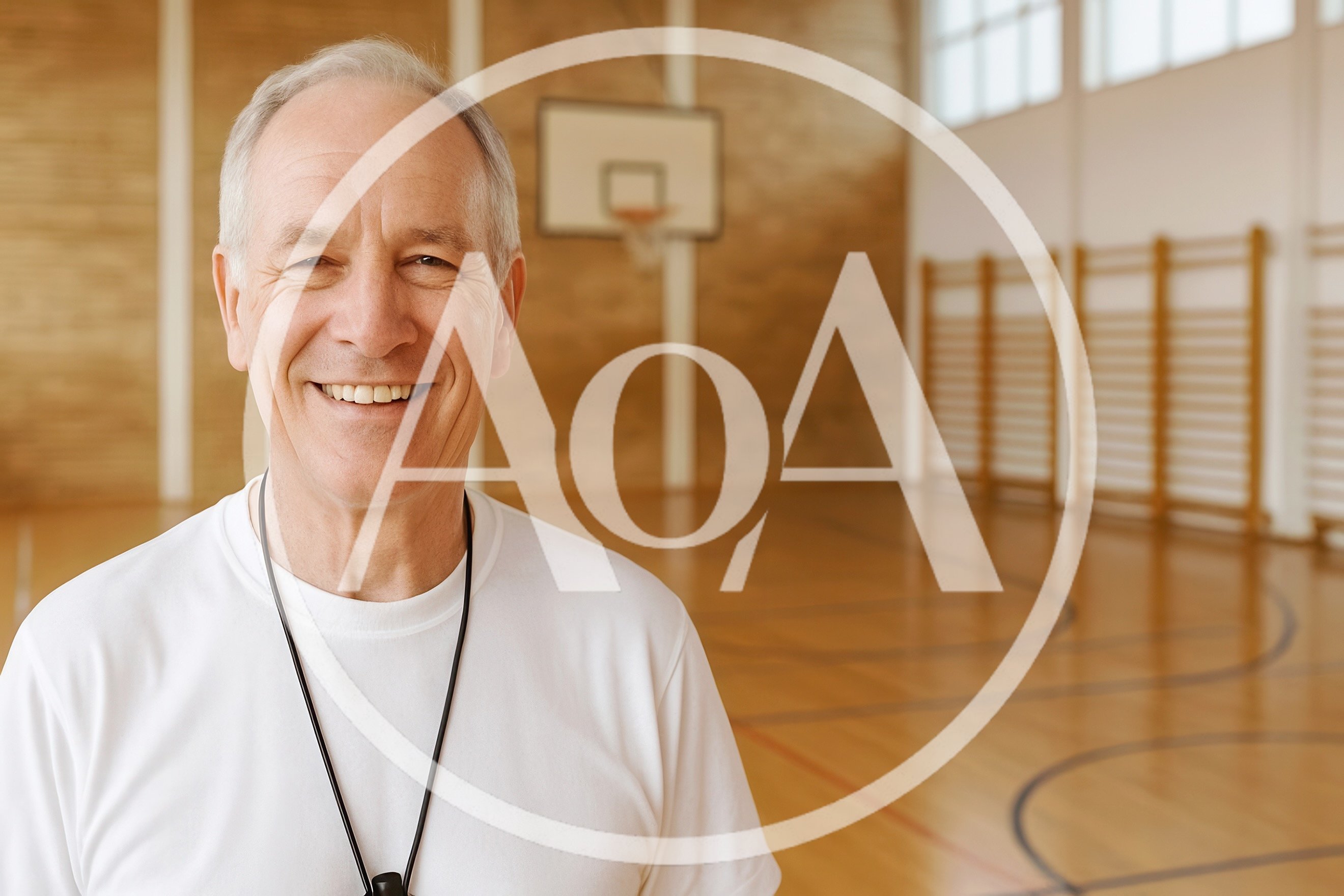 Smiling Senior Physical Education Teacher In A Gymnasium