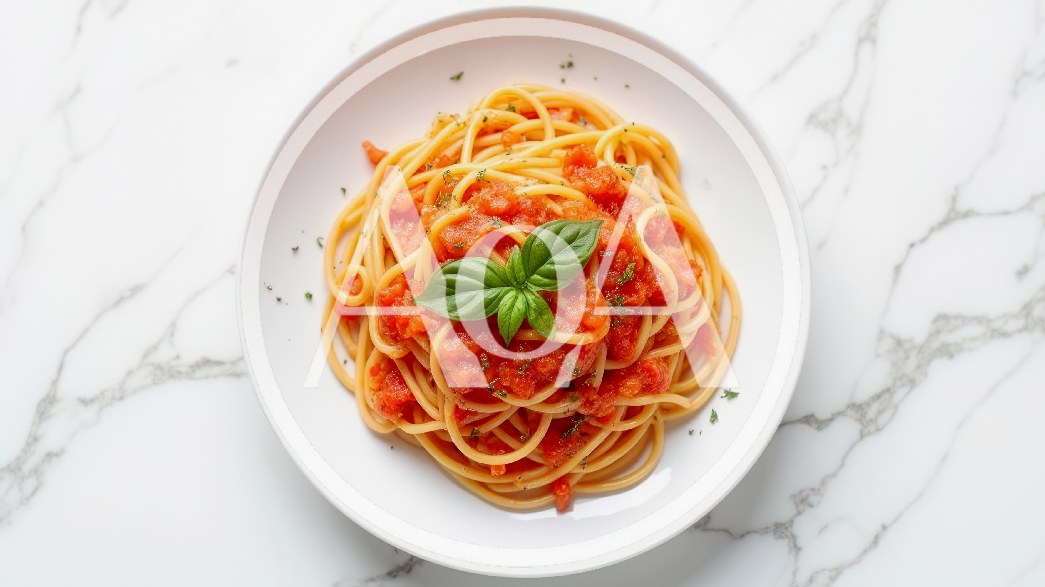 Spaghetti Pomodoro with Fresh Basil on Marble Surface