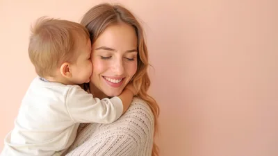 Mother Holding Her Toddler Son In A Tender Embrace