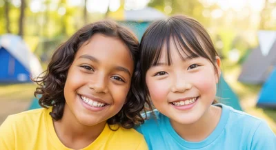 Two Diverse Young Girls Smiling Together at Summer Camp