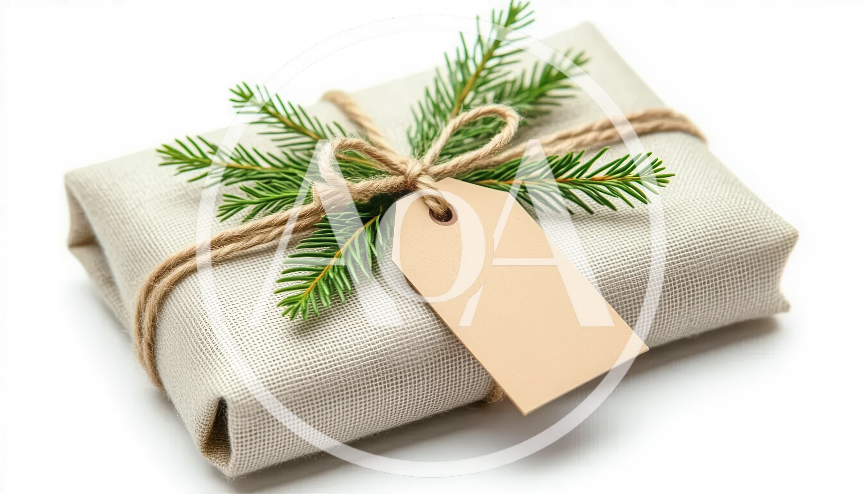 Gift Wrapped In Linen With Pine Sprig And Tag