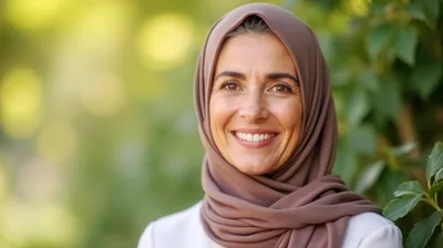 Portrait Of A Smiling Mature Woman Wearing A Hijab