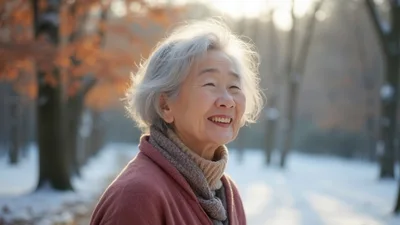 Smiling Elderly Asian Woman Outdoors In Winter