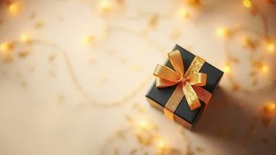 Black Gift Box With Gold Ribbon And Fairy Lights