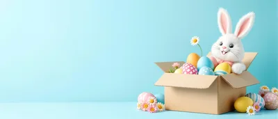 Cute Easter Bunny Sitting In A Cardboard Box