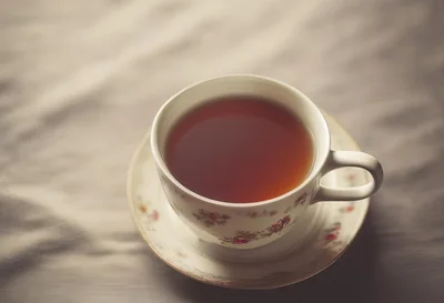 Vintage Floral Teacup Filled With Hot Black Tea