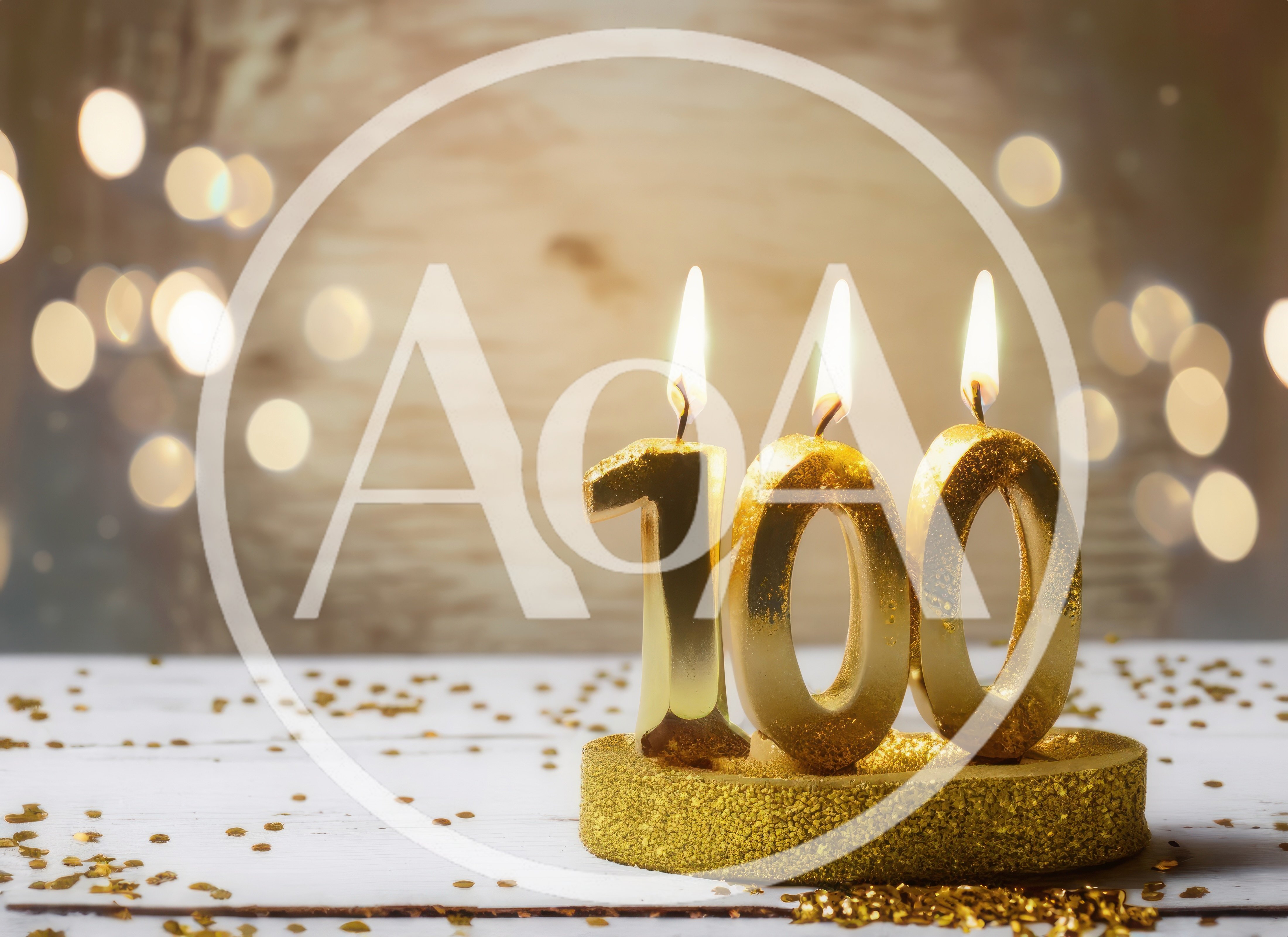 Golden One Hundred Birthday Candles on White Table