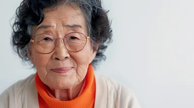 Portrait Of An Elderly Asian Woman Wearing Glasses