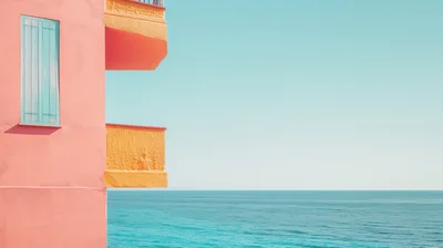 Minimalist Pink Building Balcony Overlooking The Blue Sea