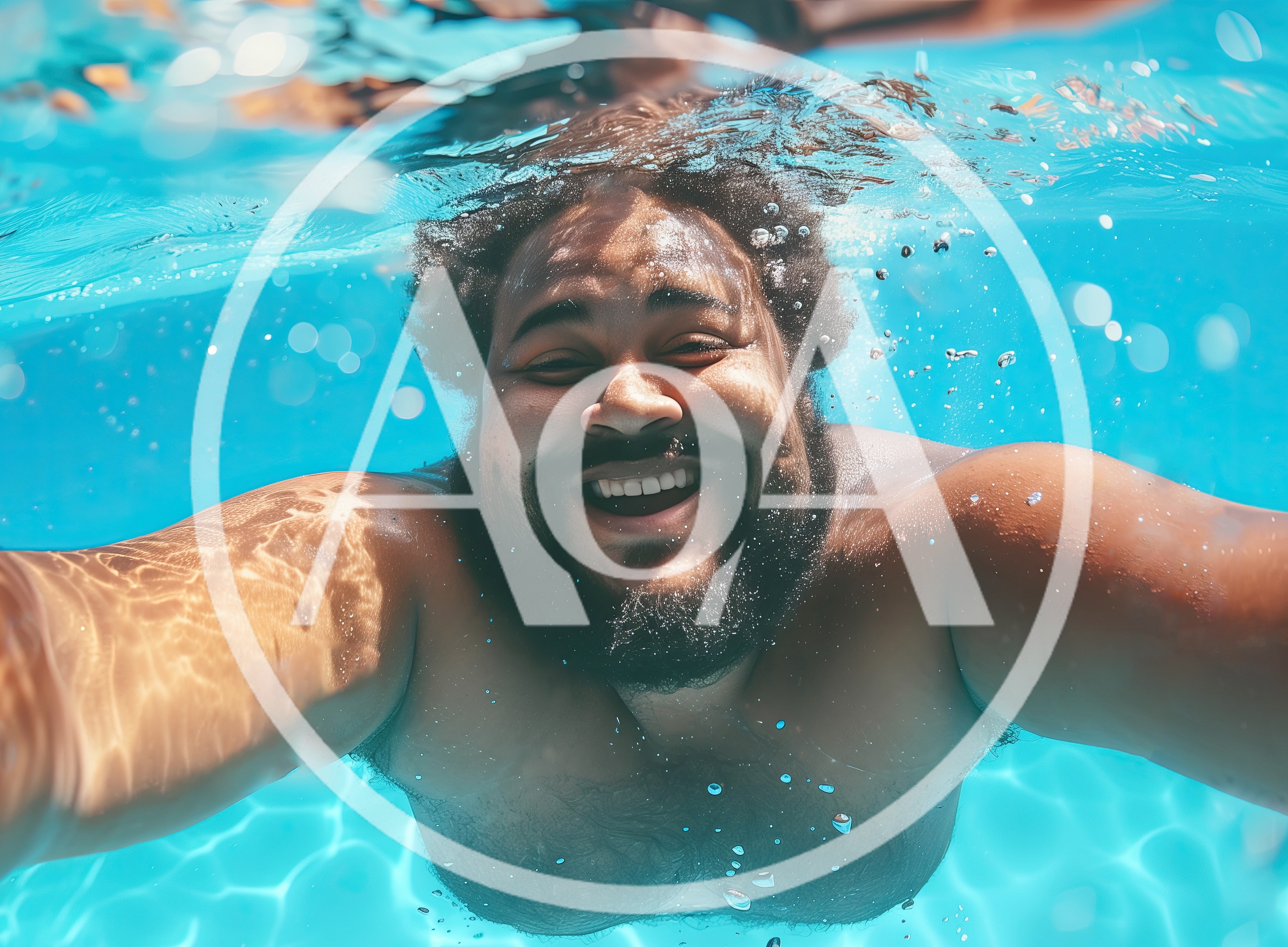 Happy Man Swimming Underwater In A Bright Pool