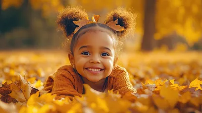Happy Little Girl Playing In Autumn Leaves