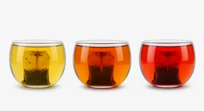Three Glass Cups With Different Tea Infusions