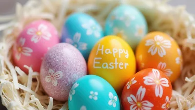 Colorful Easter Eggs Decorated With Flowers In A Nest