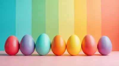 Seven Colorful Easter Eggs Lined Up On Pastel Surface