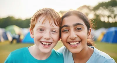 Two Happy Children Smiling Together At A Summer Camp