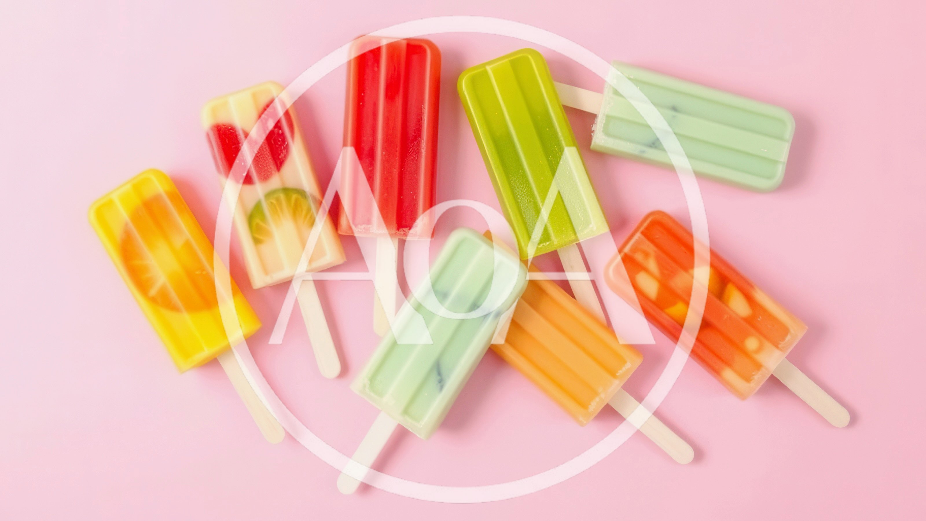 Assorted Fruit Popsicles On A Pink Background