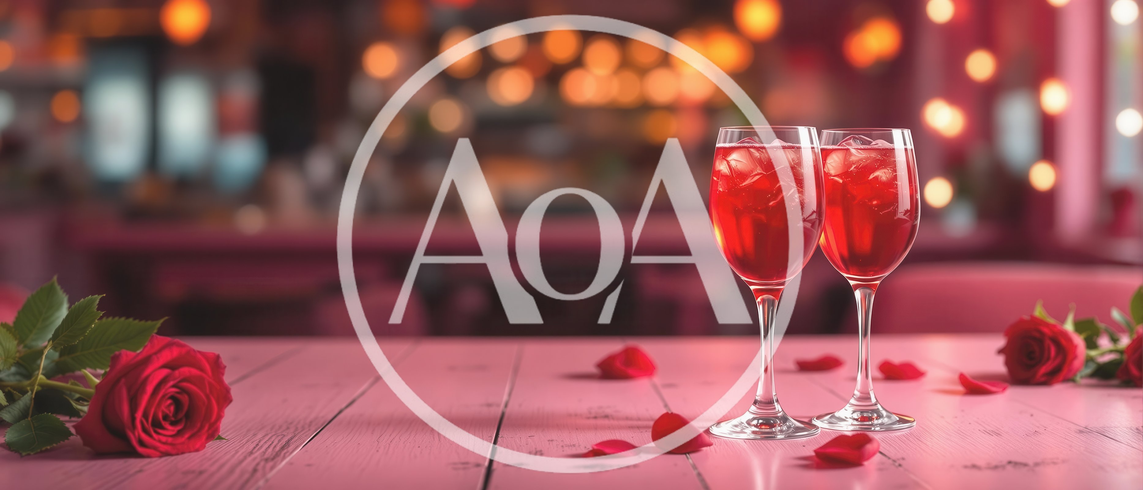 Two Glasses Of Red Cocktail With Roses On Table