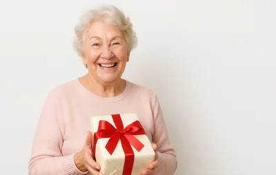 Happy Senior Woman Holding A Gift Box