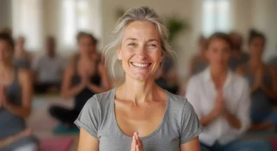 Smiling Mature Woman Practicing Yoga In A Group Class