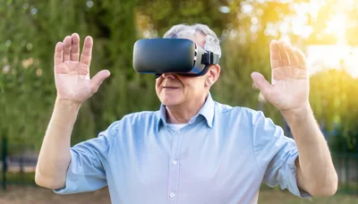 Senior Man Using Virtual Reality Headset Outdoors