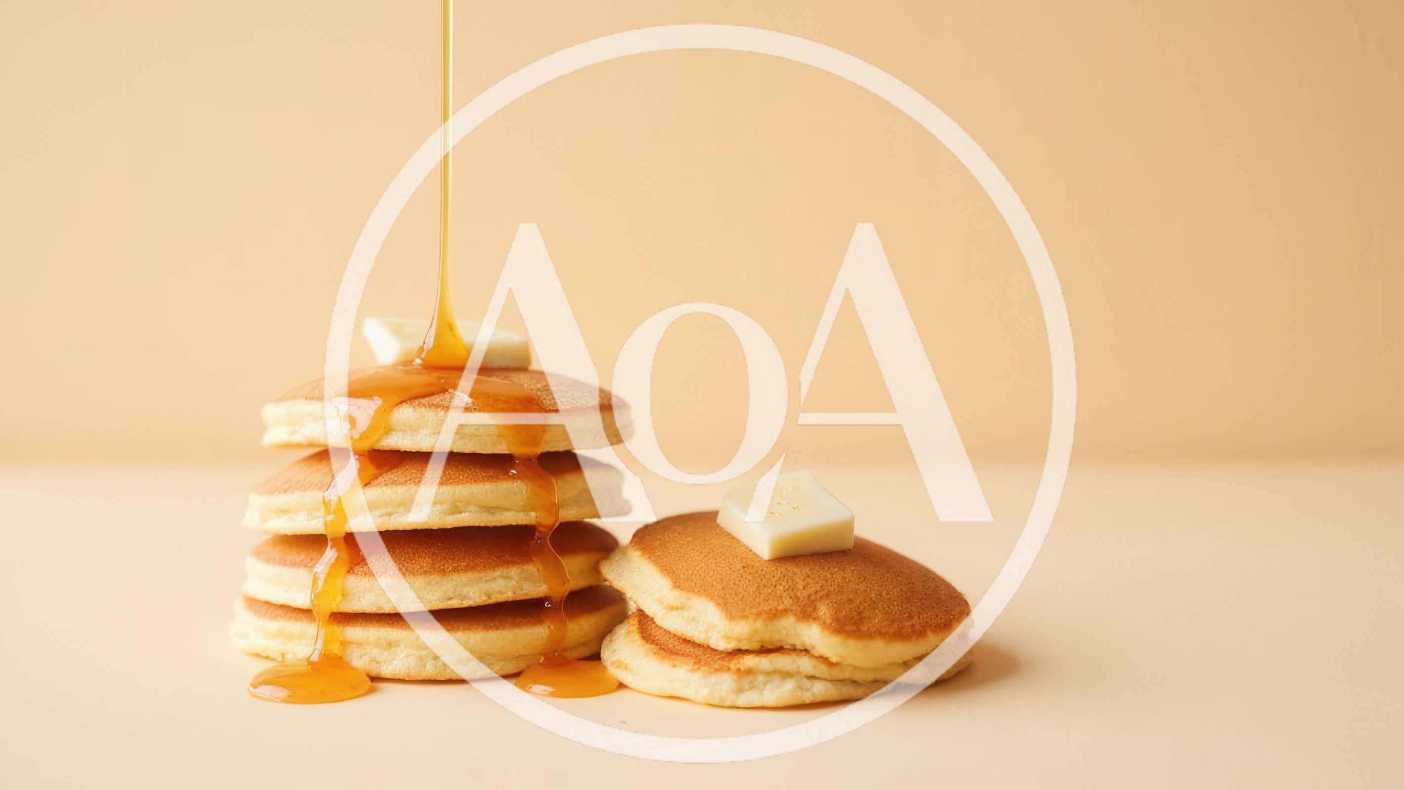 Stack Of Pancakes With Syrup Pouring And Butter