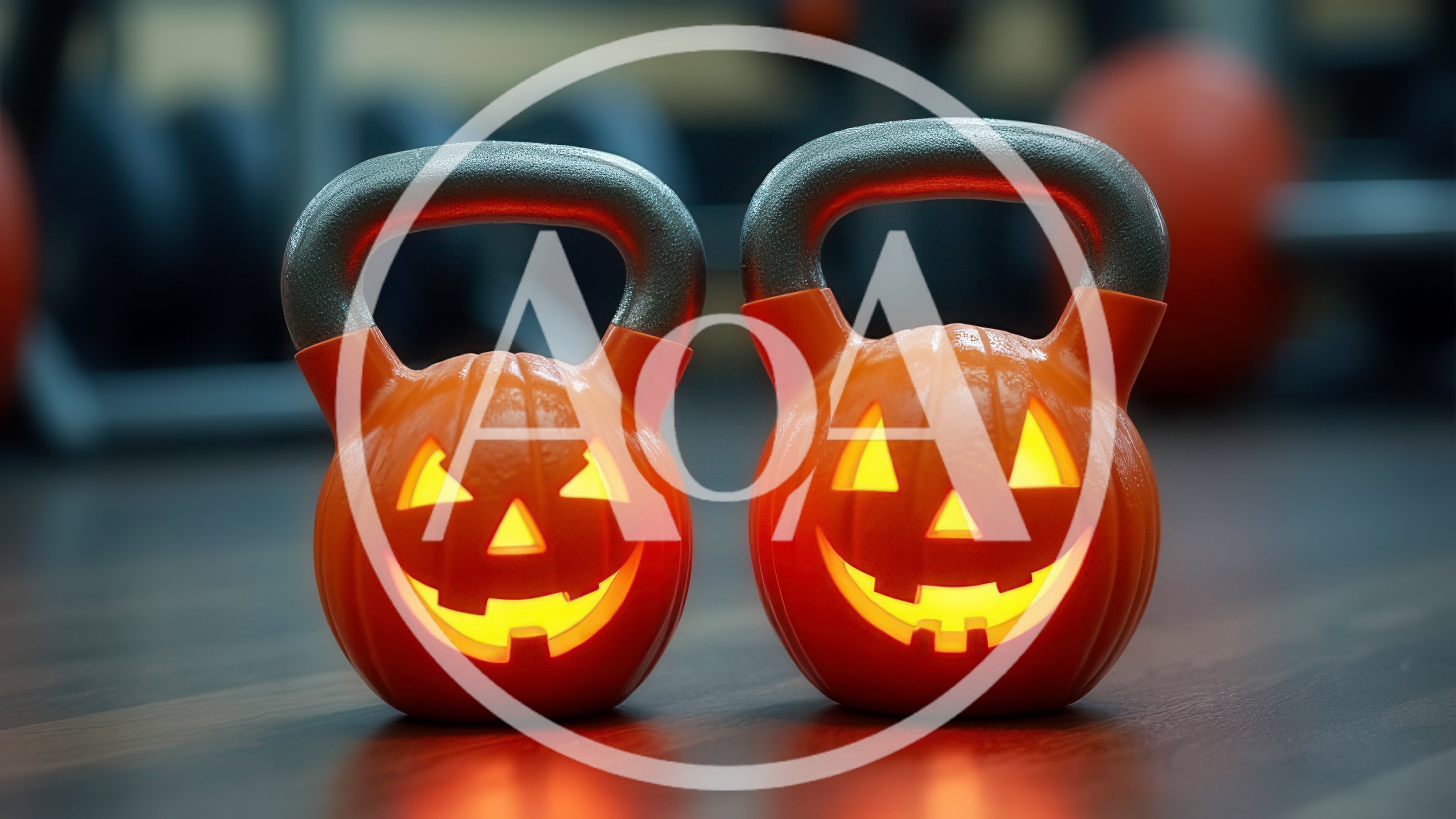 Two Pumpkin Kettlebells In A Gym Setting