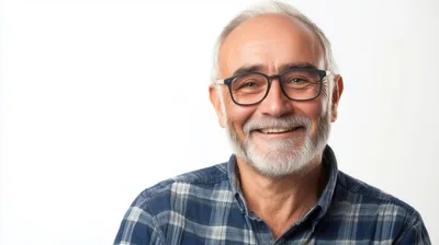 Portrait Of A Smiling Senior Man With Glasses