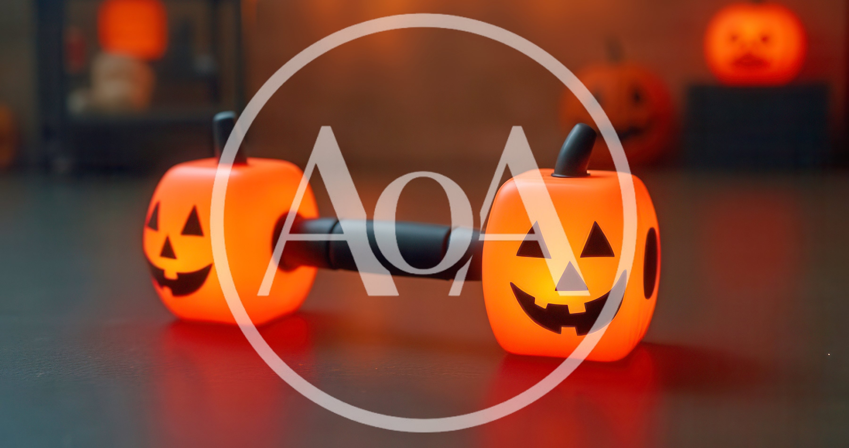 Halloween Pumpkin Dumbbell Decoration on Dark Surface