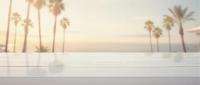 Empty White Table Overlooking Tropical Beach Sunset