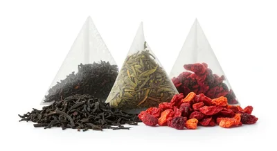 Three Pyramid Tea Bags With Loose Tea And Berries