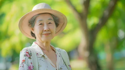 Portrait Of A Smiling Senior Asian Woman In A Park