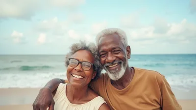 Happy Senior Couple Embracing on a Tropical Beach
