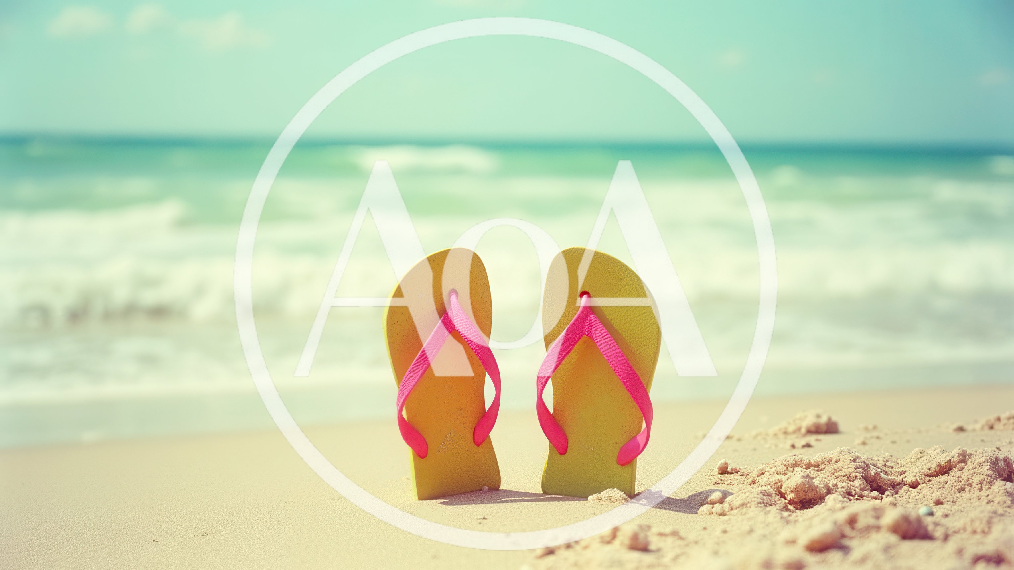Yellow Flip Flops Standing On Sandy Beach