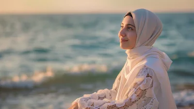 Young Woman Wearing Hijab Smiling At The Beach