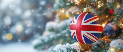 Union Jack Christmas Ornament Hanging On Snowy Tree