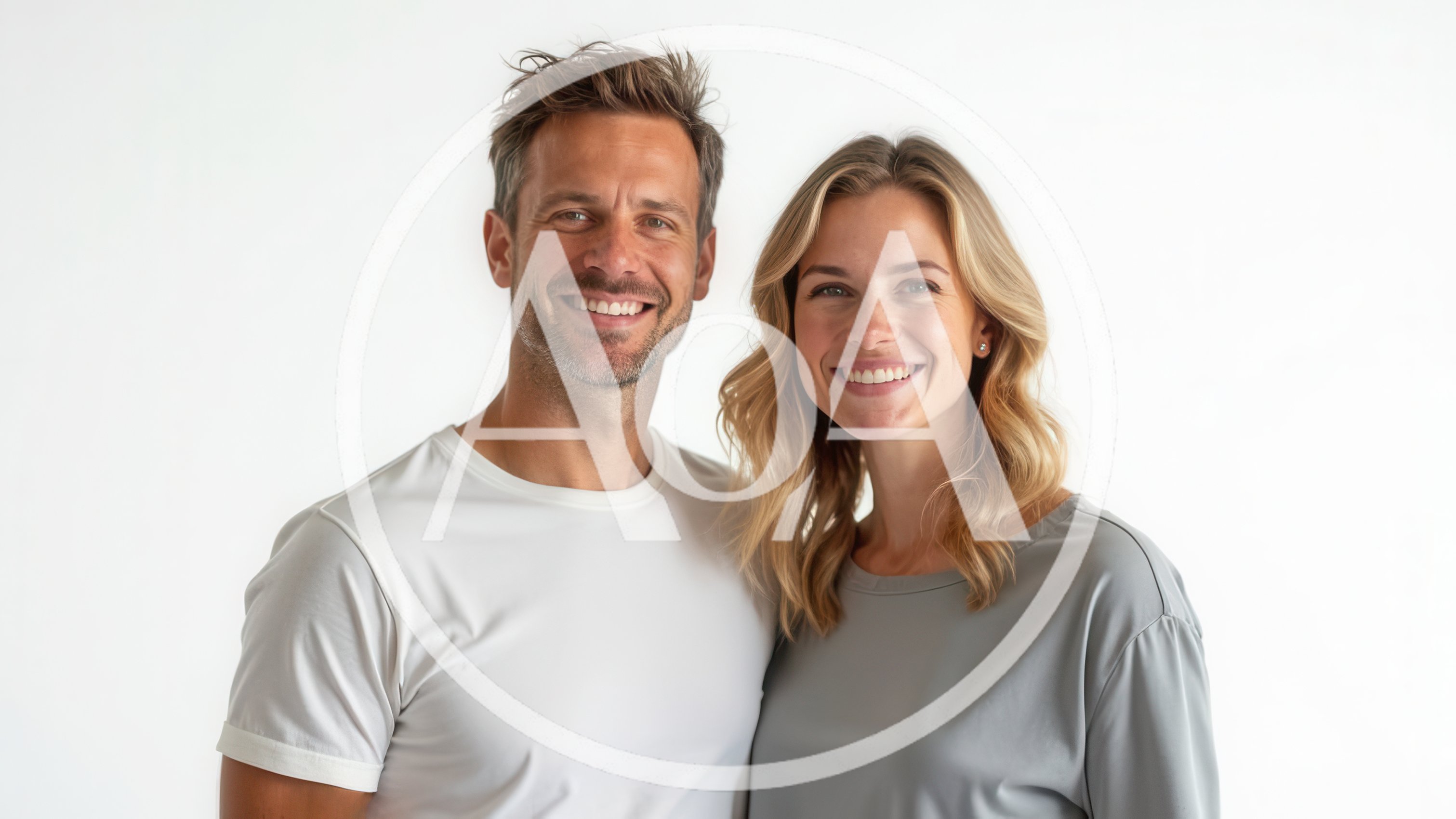 Portrait Of A Smiling Couple Against White Background