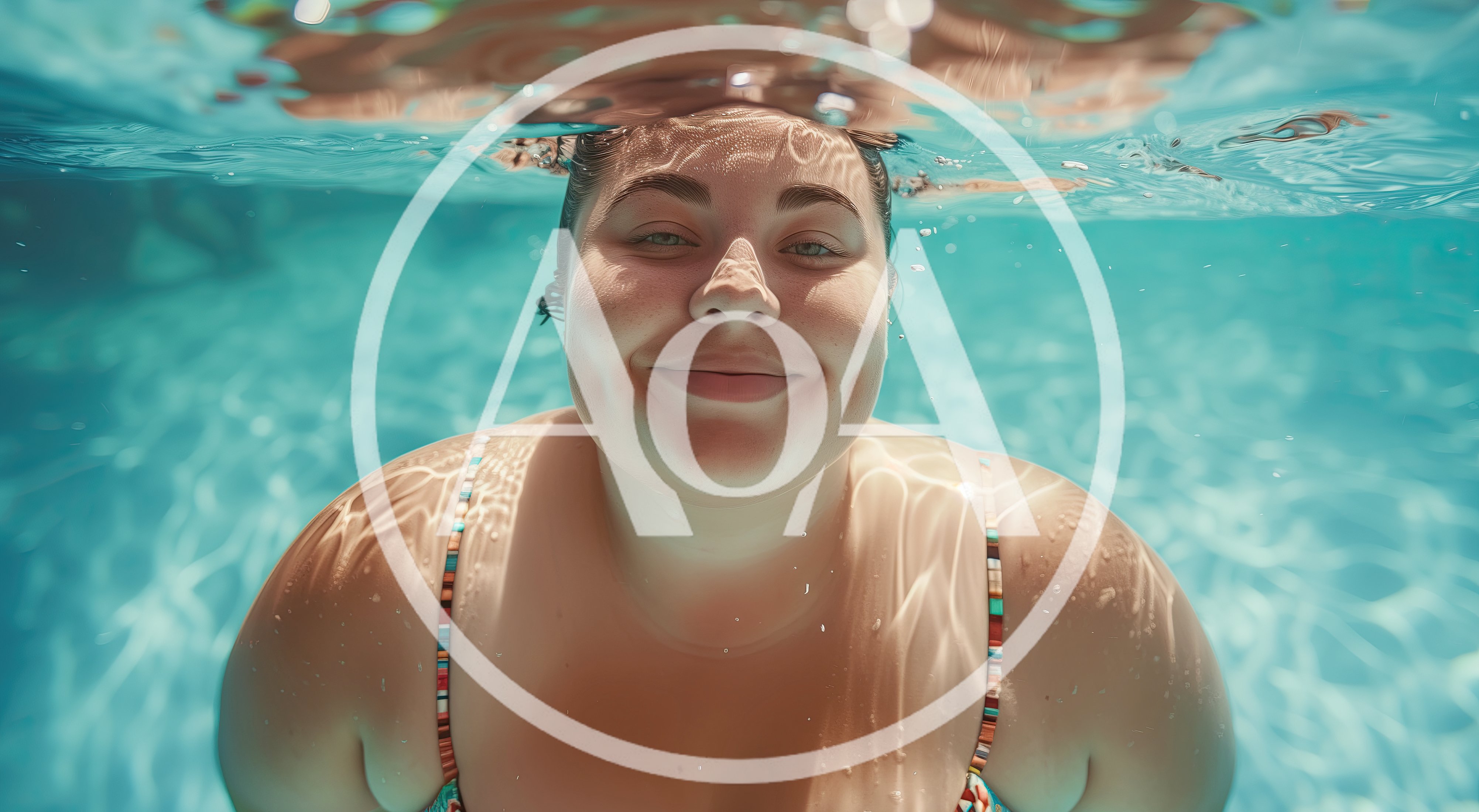 Young Woman Smiling Underwater In A Swimming Pool