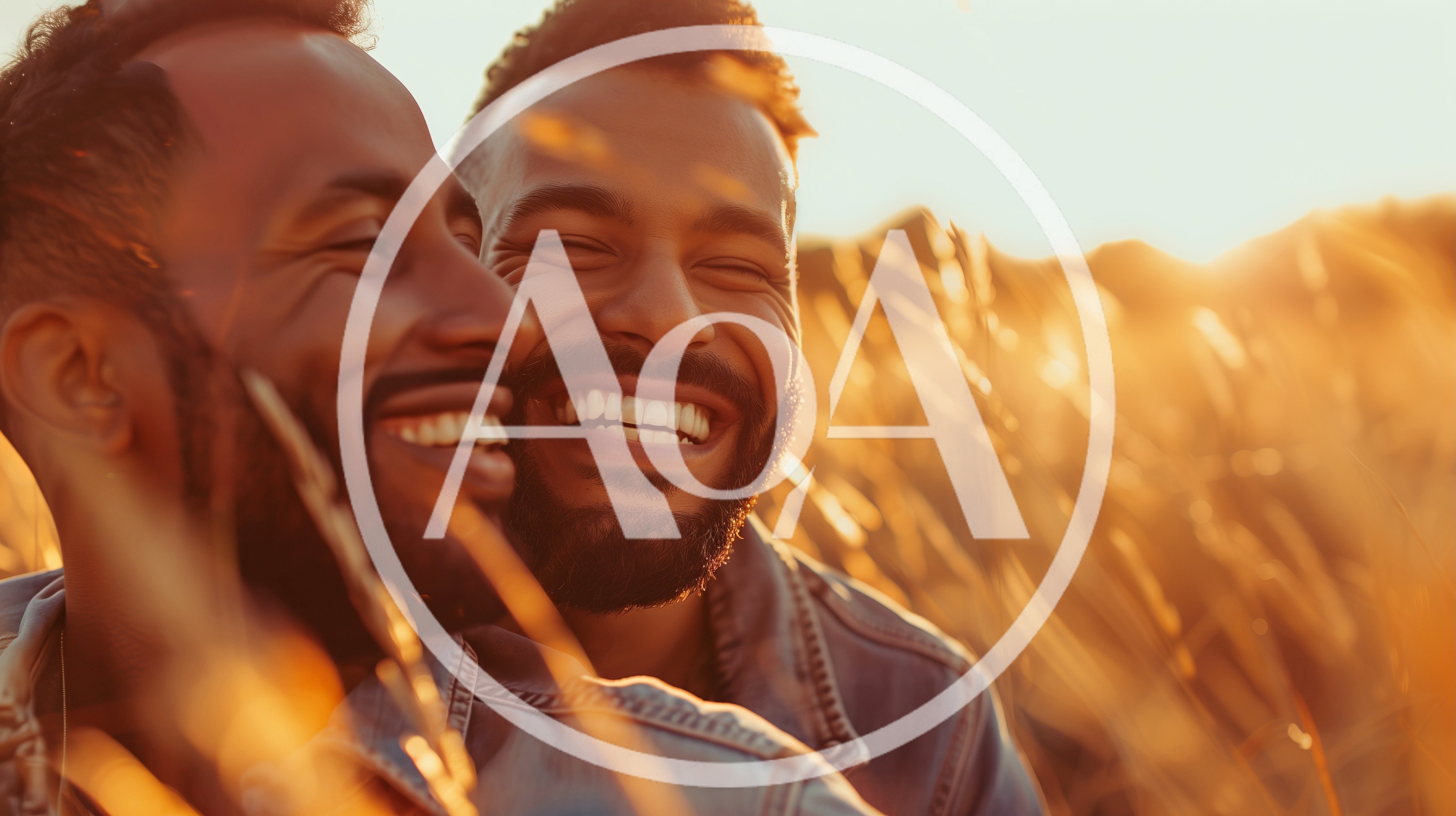 Two Happy Men Laughing Together In A Golden Field