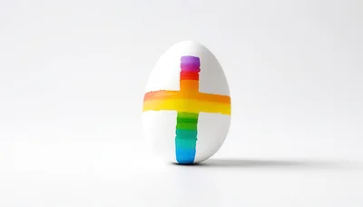 White Egg With Painted Rainbow Cross Symbol