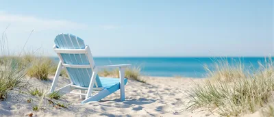 Blue Adirondack Chair On A Sunny Sandy Beach