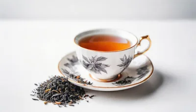 Cup Of Black Tea With Loose Tea Leaves