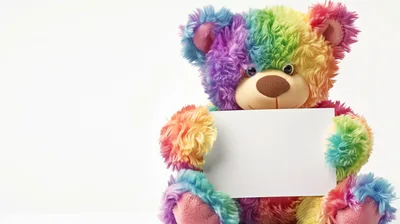 Rainbow Colored Teddy Bear Holding Blank White Sign