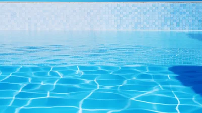 Clear Blue Water In A Tiled Swimming Pool