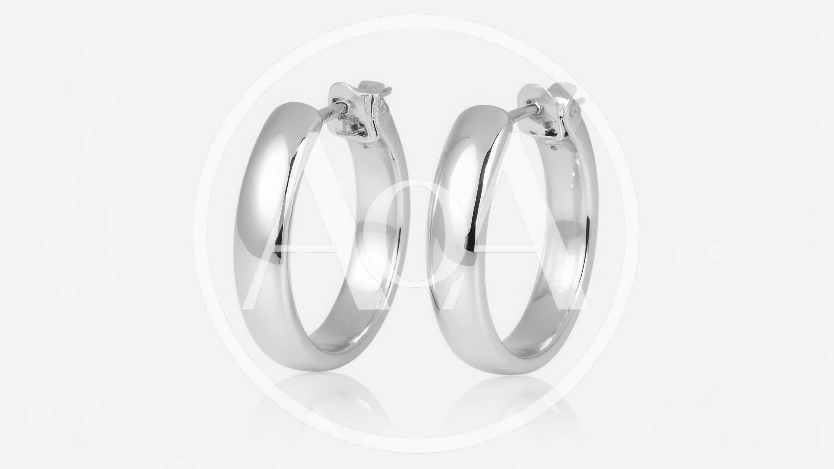 Pair Of Polished Silver Hoop Earrings